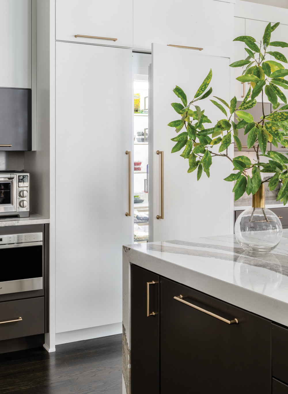 white integrated refrigerator with gold handles